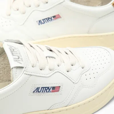 Shop Autry Medalist White/bronze Sneakers