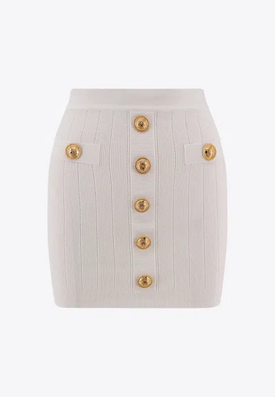 Shop Balmain Button-embellished Mini Knit Skirt In White