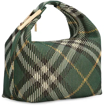Shop Burberry Peg Handbag In Green
