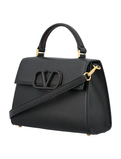 Shop Valentino Garavani Small Vsling Handbag In Black/rubin