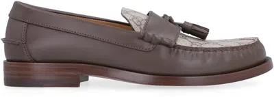 Shop Gucci Leather Loafers With Decorative Tassels In Brown