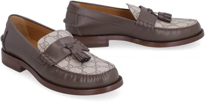 Shop Gucci Leather Loafers With Decorative Tassels In Brown