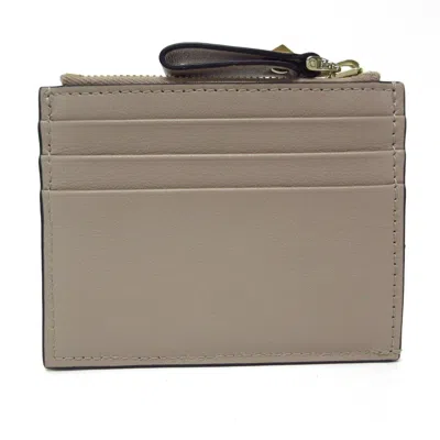 Shop Valentino Garavani Rockstud Beige Leather Wallet  ()