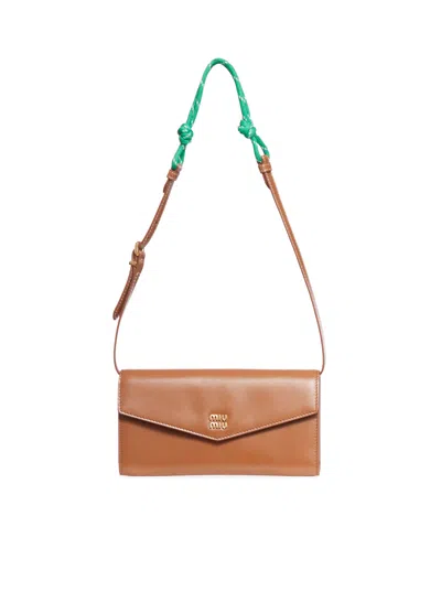 Shop Miu Miu Wallet With Leather And Rope Shoulder Strap In Brown