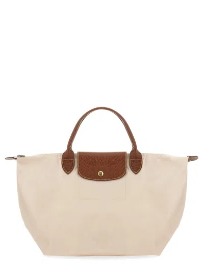 Shop Longchamp Le Pliage Medium Bag In Beige