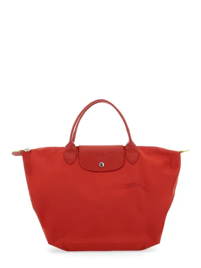 Shop Longchamp Le Pliage Medium Bag In Red