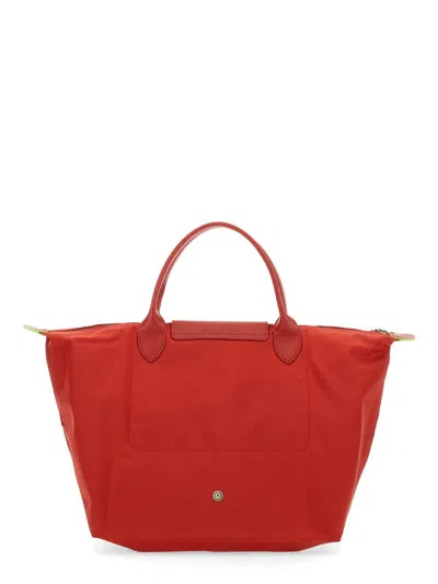Shop Longchamp Le Pliage Medium Bag In Red