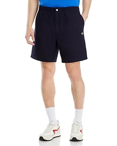 Shop Lacoste Relaxed Fit 7 Shorts In Blue