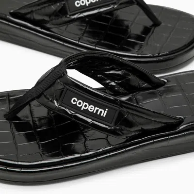 Coperni Logo-appliquéd Rubber-trimmed Croc-effect Patent Leather Flip Flops In Black