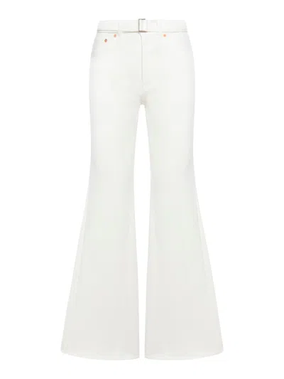 Shop Sacai Flared Jeans In White