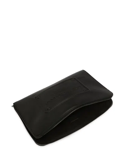 Shop Dolce & Gabbana Embossed Logo Clutch Bag In Black
