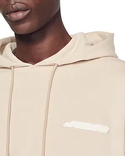 Shop Sandro Fleece Logo Hoodie In Beige