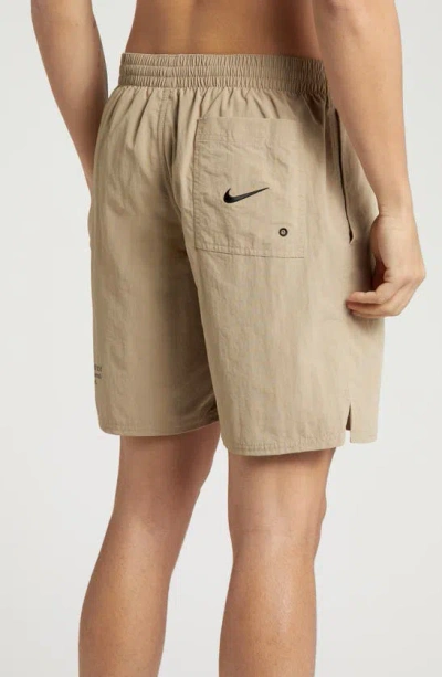 Shop Nike Swoosh 7-inch Swim Trunks In Khaki