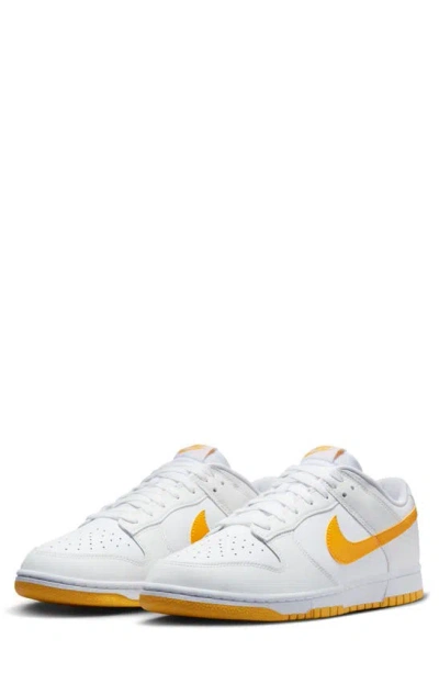 Shop Nike Dunk Low Retro Basketball Shoe In White/ University Gold/ White