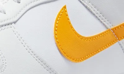 Shop Nike Dunk Low Retro Basketball Shoe In White/ University Gold/ White