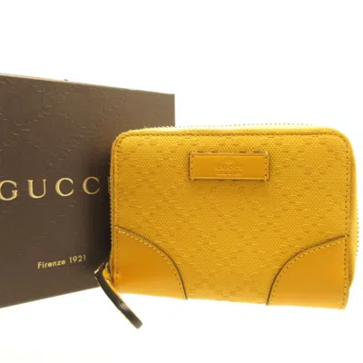 Shop Gucci Yellow Canvas Wallet  ()