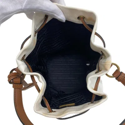 Shop Prada Bucket Bag White Canvas Handbag ()