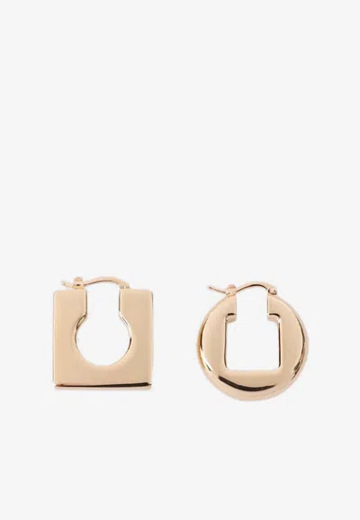 Shop Jacquemus Asymmetric Mini Hoop Earrings In Gold