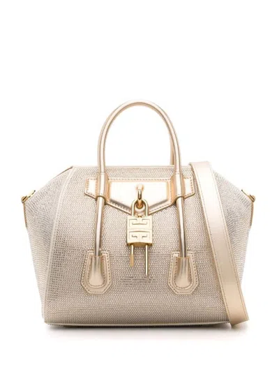Shop Givenchy Antigona Lock Mini Handbag In Golden