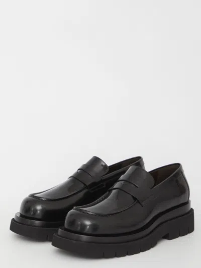 Shop Bottega Veneta Lug Flat Loafers In Black