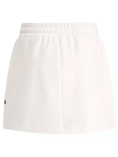 Shop Dolce & Gabbana Jersey Miniskirt With Dg Logo Patch In White
