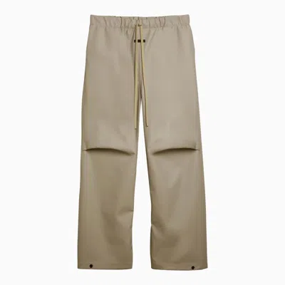 Shop Fear Of God Rubberized Wide-leg Trousers Dune Men In Cream