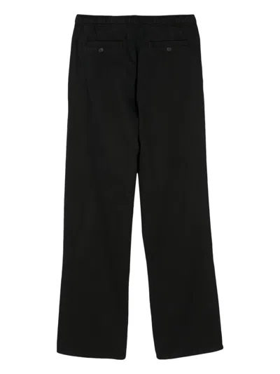 Shop Palm Angels Trousers With Logo