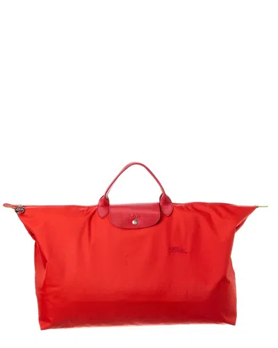Shop Longchamp Le Pliage Green Medium Canvas Travel Bag In Red