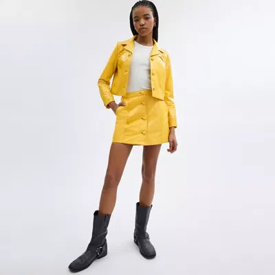 Shop Coach Heritage C Patent Leather Jacket In Yellow