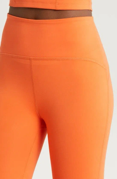 Shop Beyond Yoga Powerbeyond™ Strive High Waisted Midi Leggings In Sunset Orange