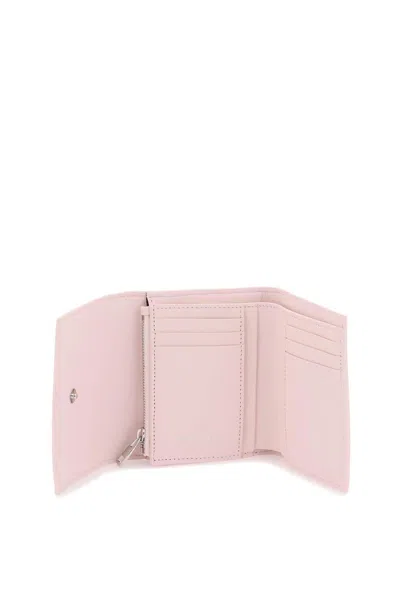 Shop Alexander Mcqueen Compact Skull Wallet In 粉色的