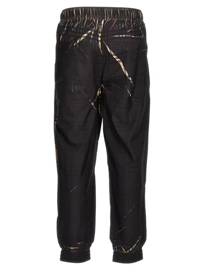 Shop Burberry 'deanstone' Joggers In Black