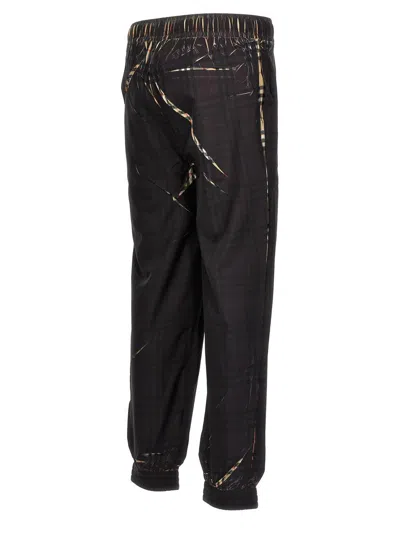 Shop Burberry 'deanstone' Joggers In Black
