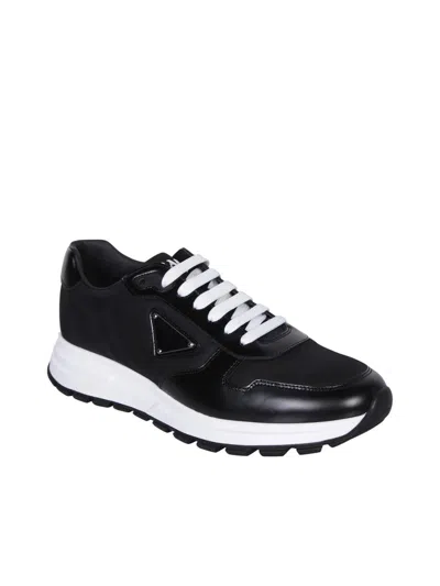 Shop Prada Sneakers In Black