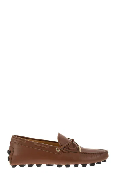 Shop Tod's Bubble Leather Grommet In Cognac