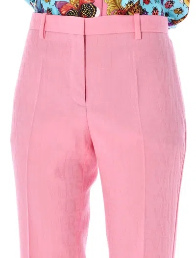 Shop Versace Flared Pants In Pastel Pink