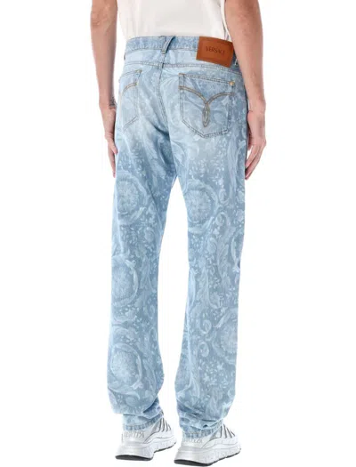 Shop Versace Allover Jeans In Blue