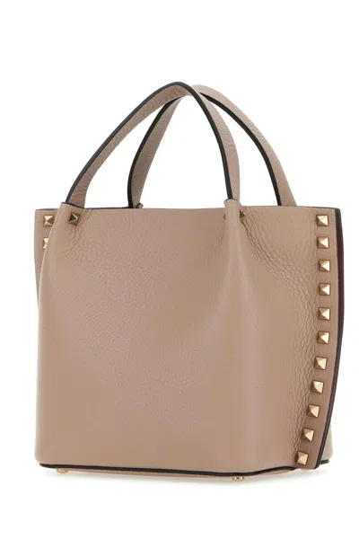 Shop Valentino Antiqued Pink Leather Rockstud Handbag In Powder