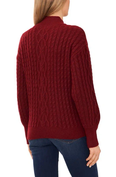 Shop Cece Mock Neck Cable Stitch Sweater In Earth Red