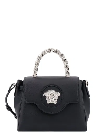 Shop Versace Handbag In Black