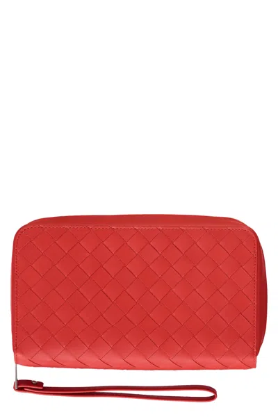 Shop Bottega Veneta Leather Zip-around Wallet In Red