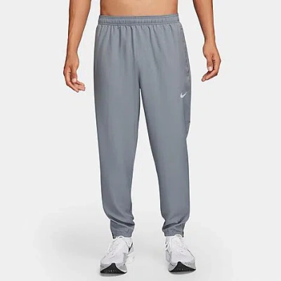 Shop Nike Men's Challenger Dri-fit Woven Running Pants In Smoke Grey/black/reflective Silver