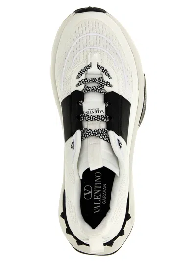 Shop Valentino Garavani True Act Sneakers In White/black