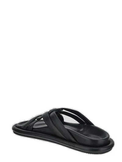 Shop Moncler Logo Embossed Sandals In Black