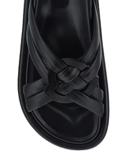 Shop Moncler Logo Embossed Sandals In Black