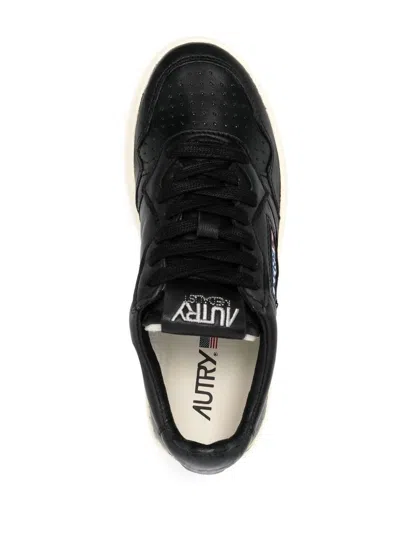Shop Autry Sneakers In Black