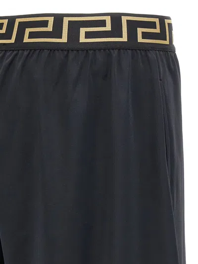 Shop Versace 'greca' Bermuda Shorts In Black