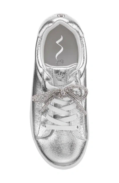 Shop Nina Kids' Metallic Bow Sneaker In Silver Cream