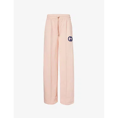 Shop Gucci Brand-print Relaxed-fit Cotton-jersey Jogging Bottoms In Soft Pink Mix