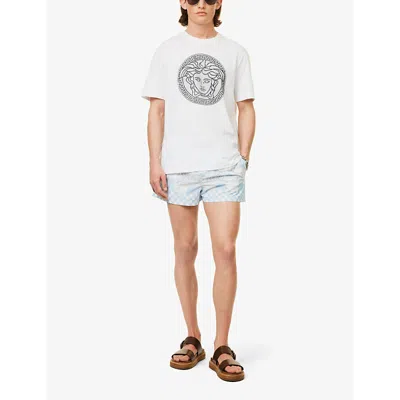 Shop Versace Check-patterned Low-rise Swim Shorts In Pastel Blue+white+silver